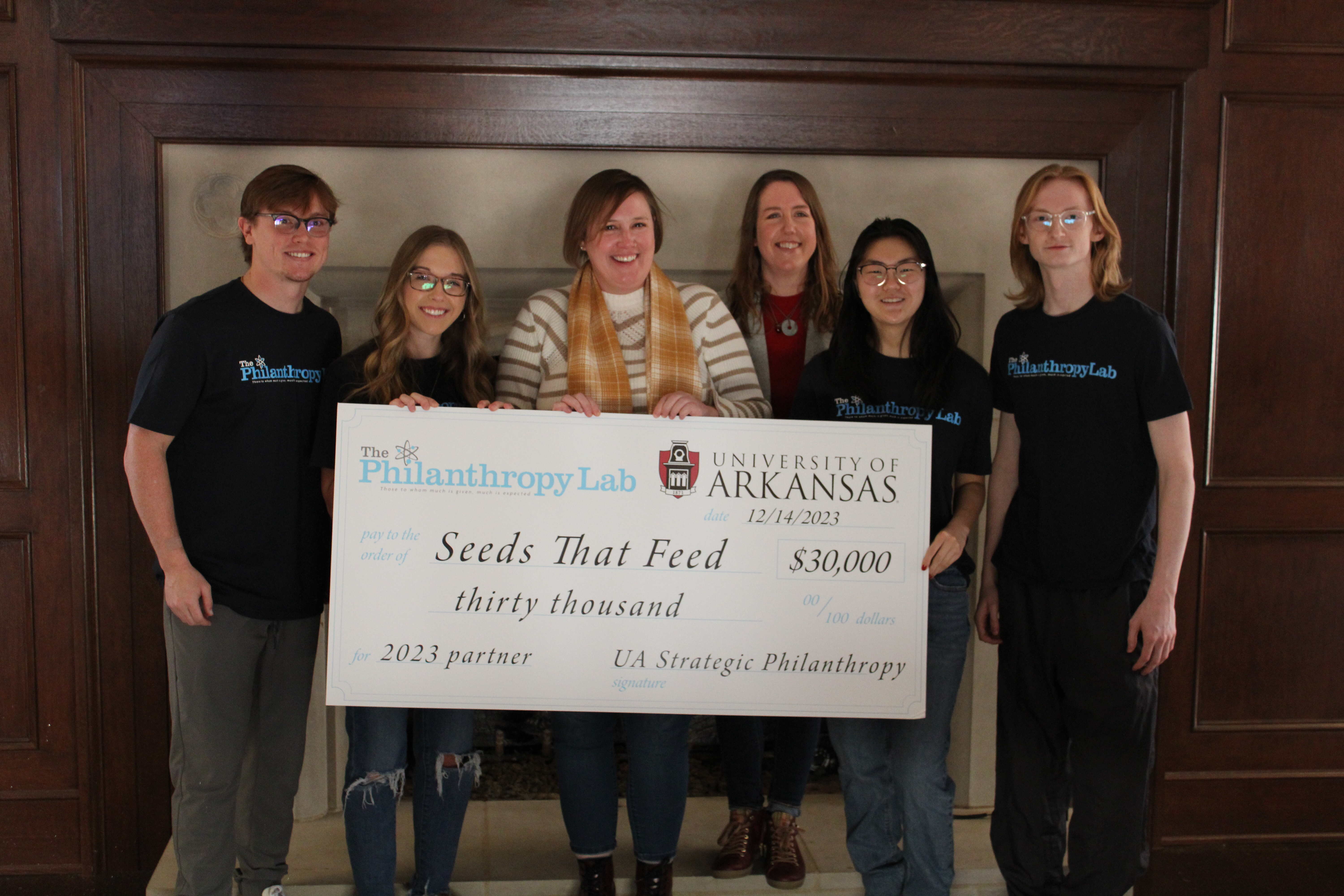 Students present check to Seeds that Feed